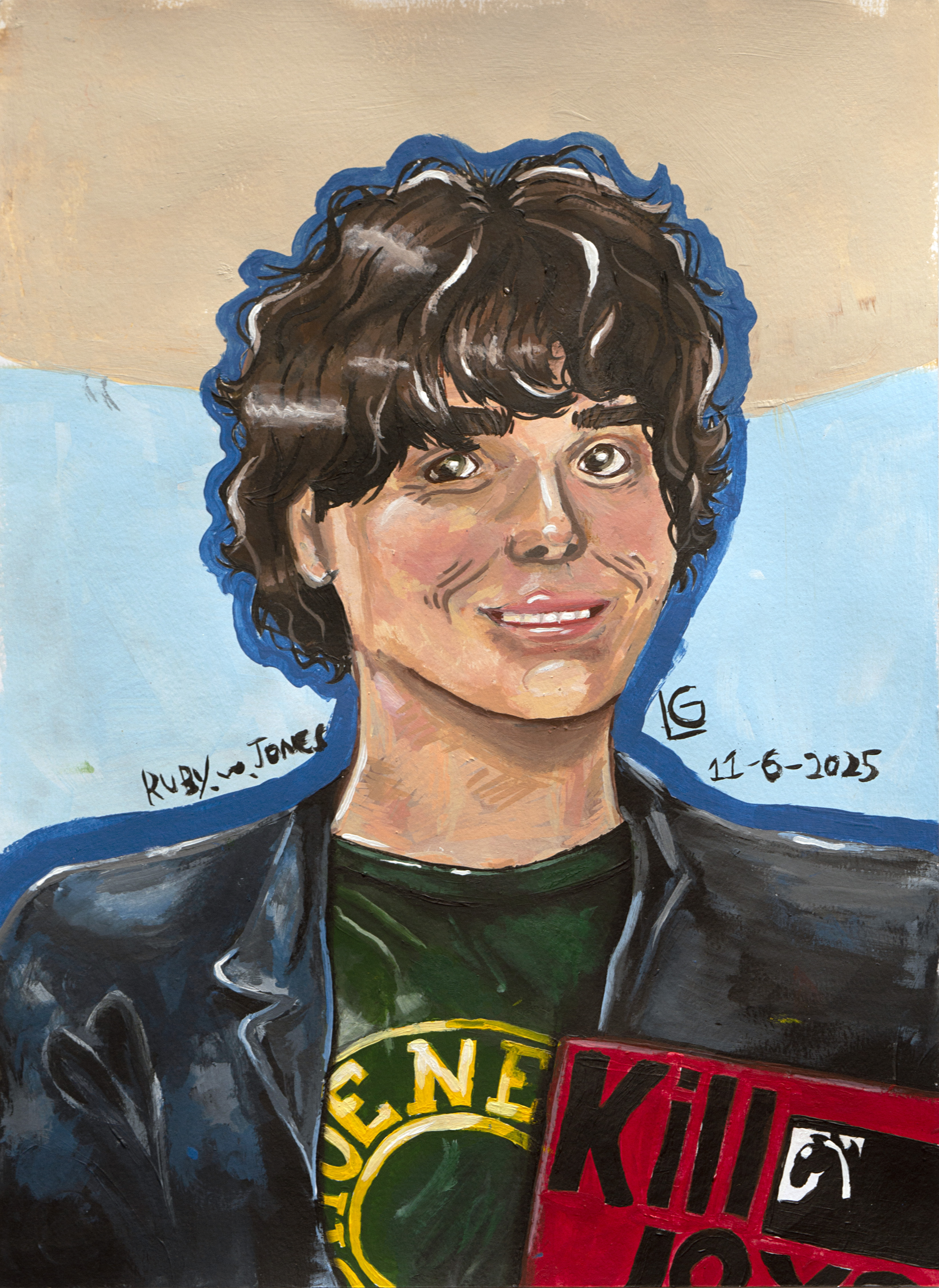 A smiling person with wavy brown hair wearing a dark jacket and green shirt holds a red book titled Killer Joy. The background is blue and beige. The artwork is signed Ruby Jones and dated 11-6-2025.